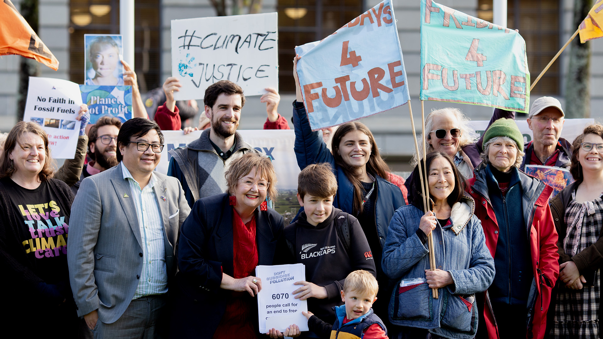 Don’t Subsidize Pollution presents a petition to Megan Woods in June 2024
