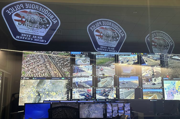 A bank of video monitors allows the police department in Albuquerque, N.M., to keep an eye on surveillance cameras throughout the city. AP Photo/Susan Montoya Bryan