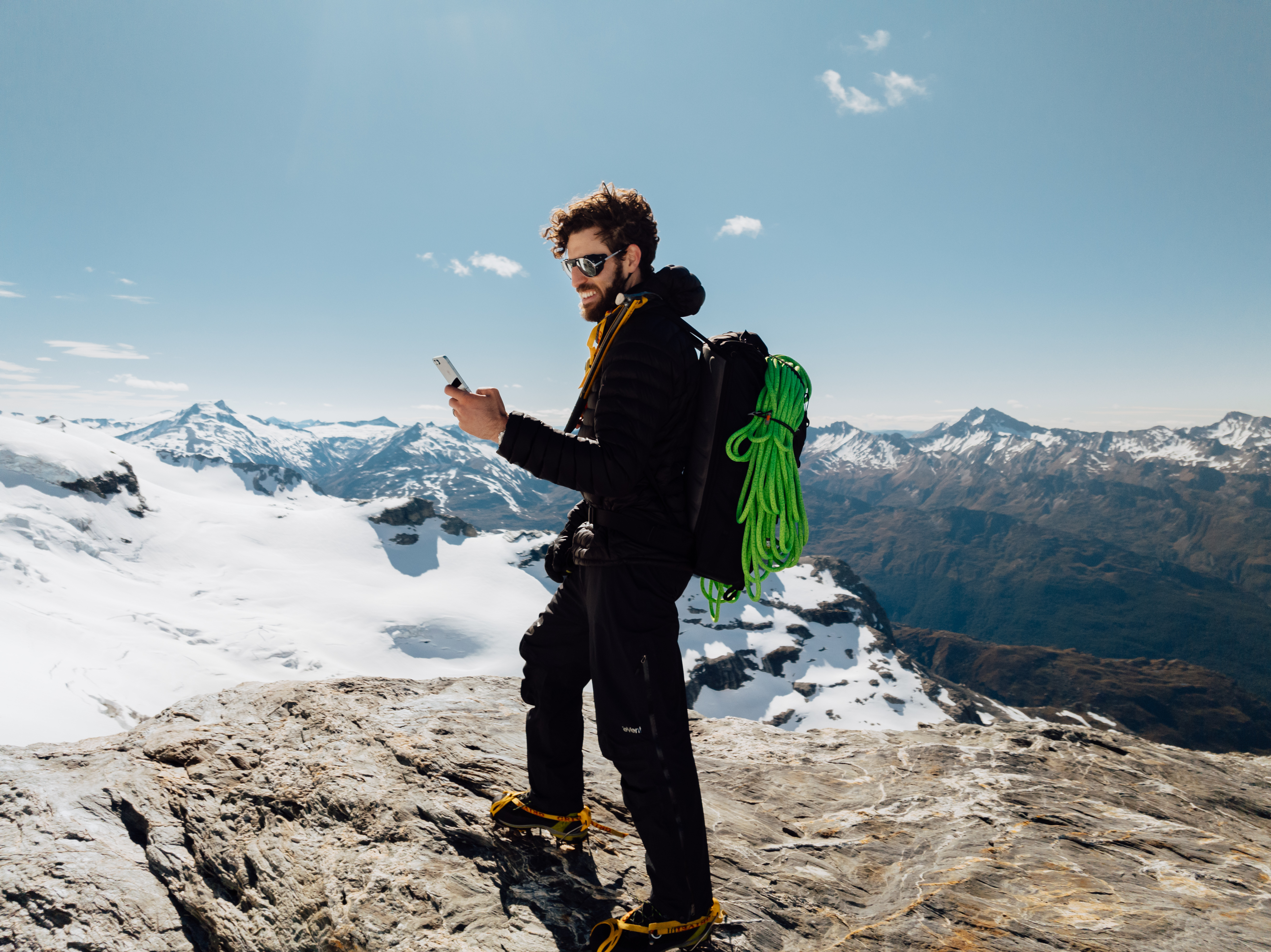 George Hillary texting on Mt Head