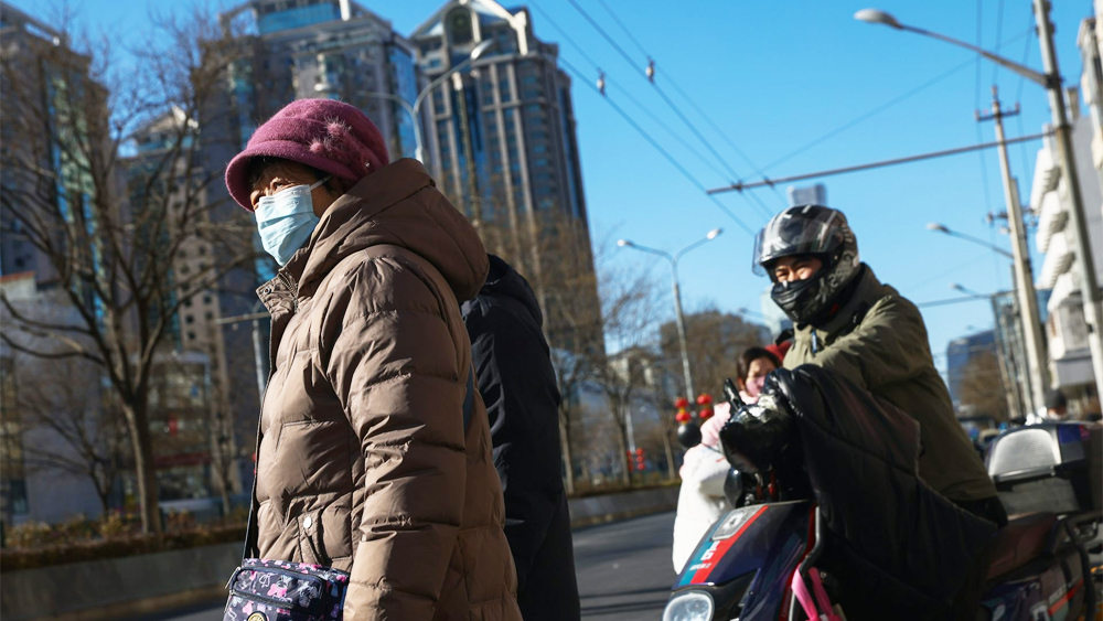 China street scene with people in masks