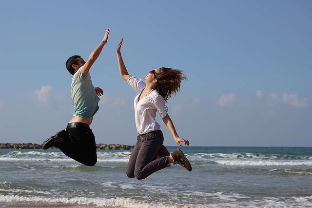 Young couple jumping for joy