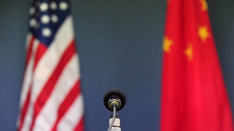 US and China flags in front of microphone