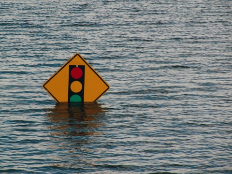 Traffic sign stands almost underwater