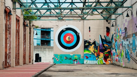 Mural of a target in a rundown building