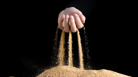 sand falling through fingers