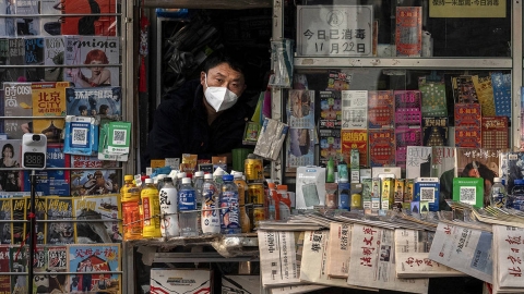 Chinese street vendor in mask