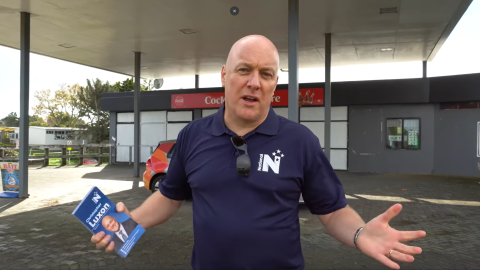 Christopher Luxon outside an empty petrol station in Cockle Bay